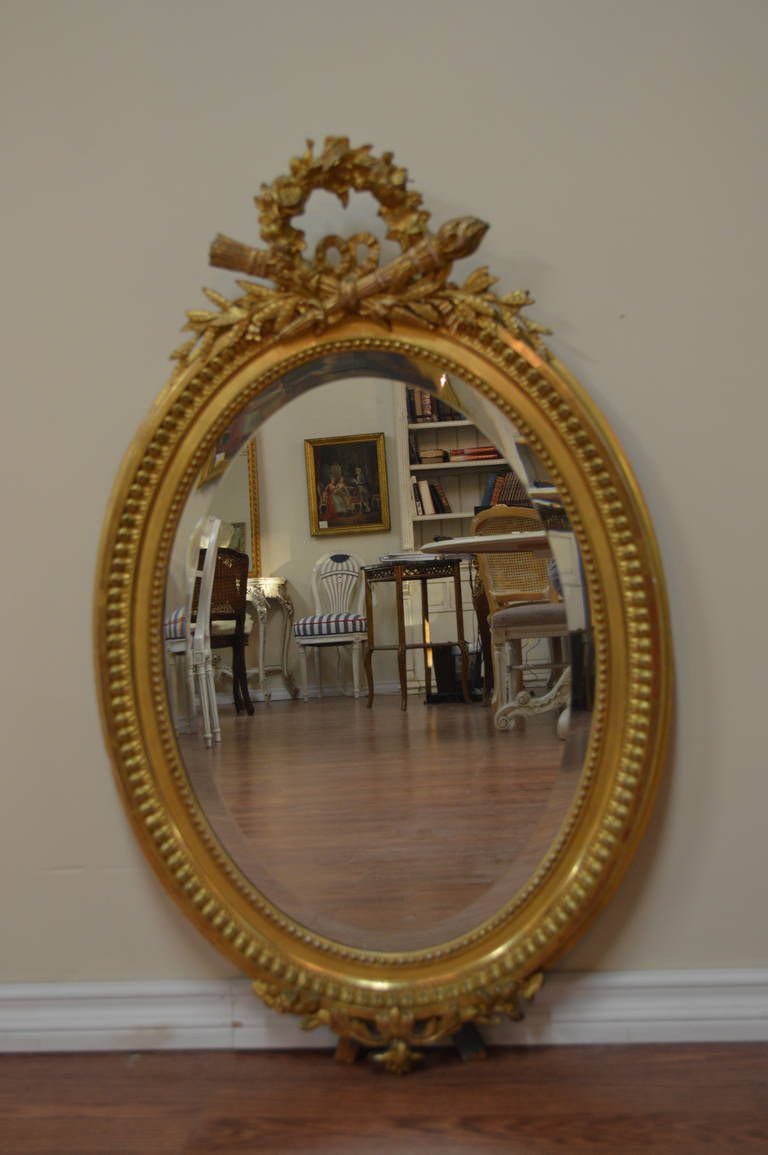 French 19th Century, Louis XVI Style Oval Gilded Mirror