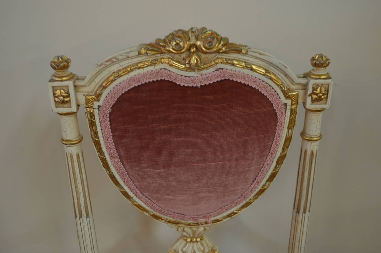 Sweet and charming Louis XVI style painted with gilt heart shape backside chair.
The pink velvet upholstery is original. There is a settee to match see listing under
settee, Louis XVI style heart shape settee.