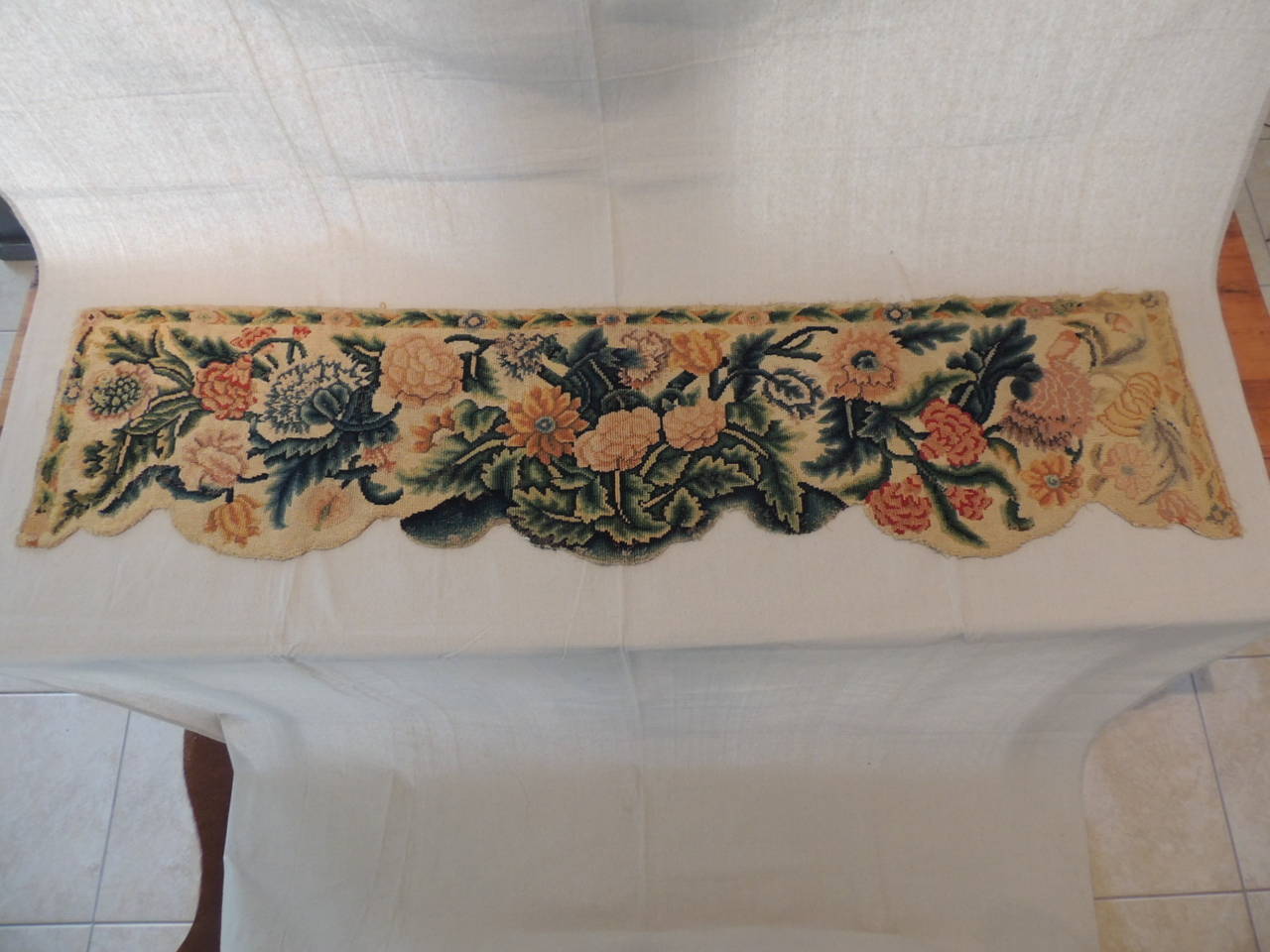 Antique Textiles Galleries...
18th century needlework tapestry valance or pelmet depicting blooming flowers and vines, in shades of green, gold, peach, pinks on a yellow background.  Ideal as a window balance or to make bolster pillows.