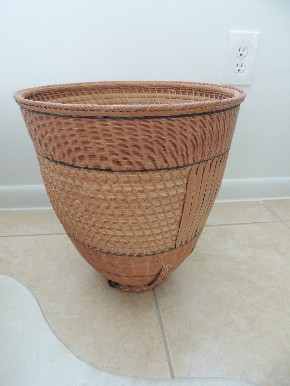 Vintage conical shape Indonesian basket, has rattan and sea grass weave into the design.