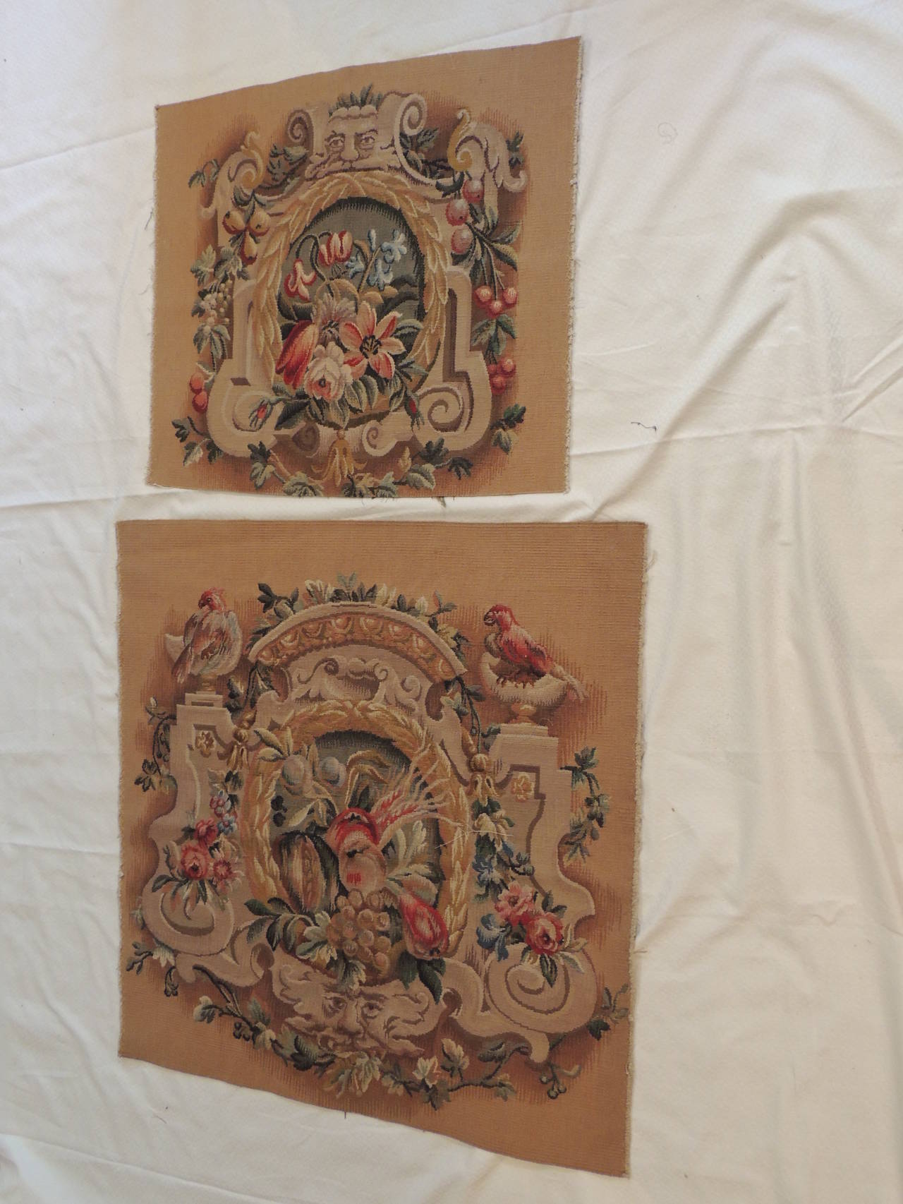 Pair of floral Aubusson tapestry panels depicting Gargoyle, blooming flowers and fruits, birds and berries. Ideal for a chair back and seat upholstery. 
Measures: Small 22 x 25
Large 31 x 32.