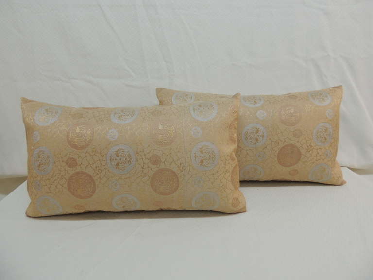 Pair of golden embroidery Japanese Obi lumbar pillows with original Vintage silk backings. Depicting medallions.