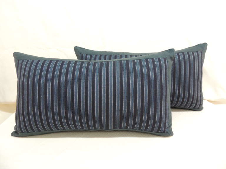Pair of Vintage stripe Japanese lumbar pillows framed with Vintage blue linen and same backings.