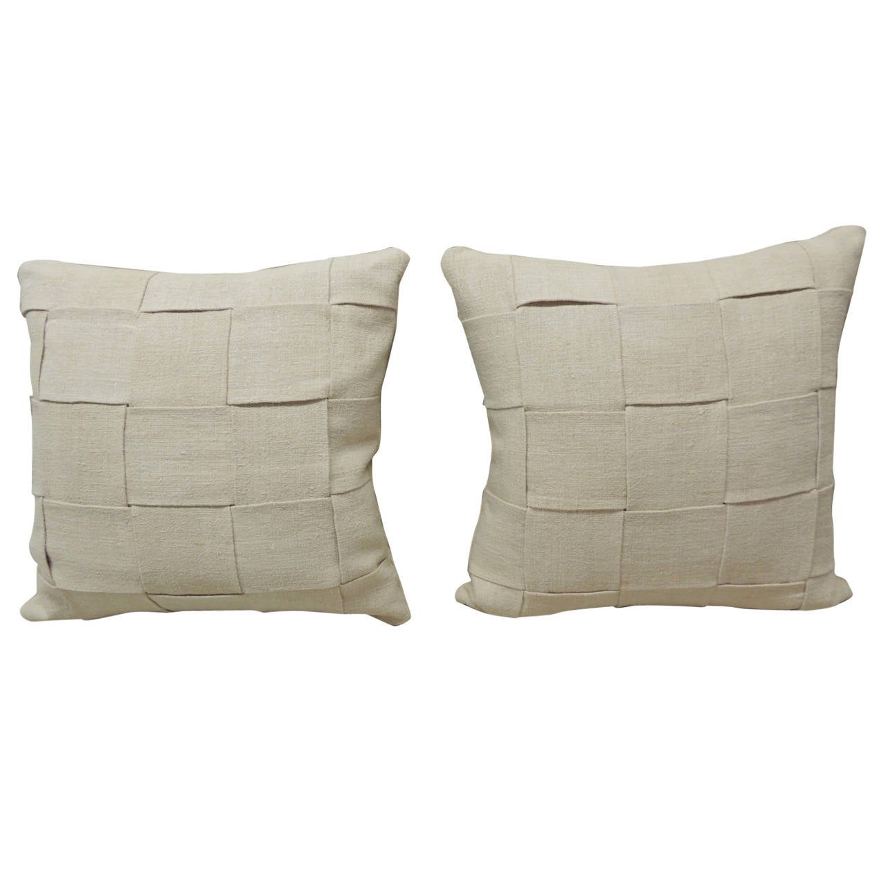 19th century homespun French oatmeal linen and natural textured linen pair of decorative pillows.   
Atelier Lam basket weave exclusive design. Natural linen backings.  Closed by hand stitch (no zipper closure.) Handcrafted and designed in the USA