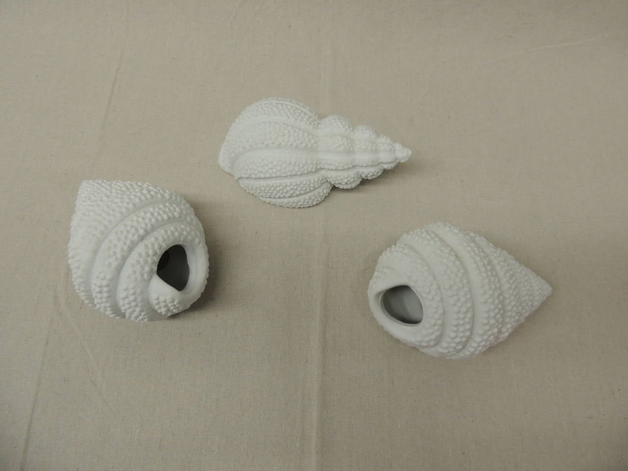 Set of (3) white bisque porcelain snail sea shells decorative figurines. Hollow inside. From 6