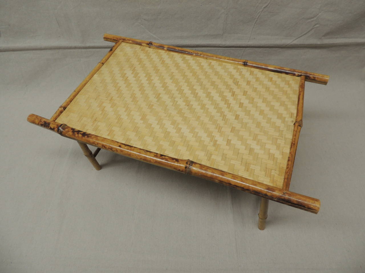 Vintage bamboo folding breakfast tray with basket weave detail top.