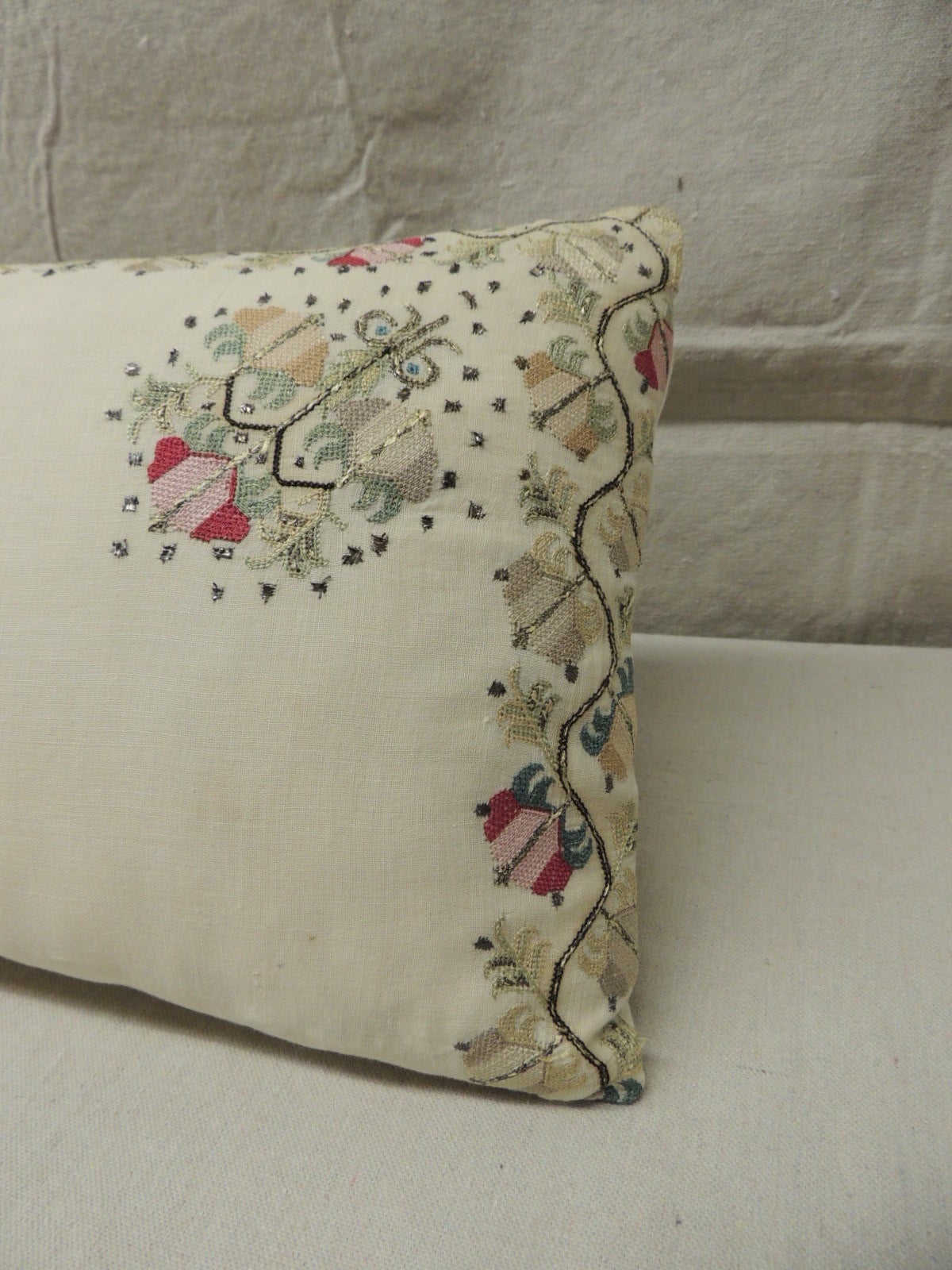 This item is part of our 7Th Anniversary SALE:
Sheer linen embroidery Turkish long bolster pillow silk and metallic threads on linen. In shades of soft green, reds, pinks, celedon, camel. Natural linen backing.  Throw pillow hand-made and designed
