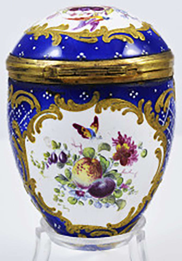 Exquisite Georgian egg shaped nutmeg grater with bird, fruit and floral decorations made in Bilston, England c1770-80. It was the fashion for men to carry nutmeg in a pocket-sized container equipped with a grater such as this one in order to add