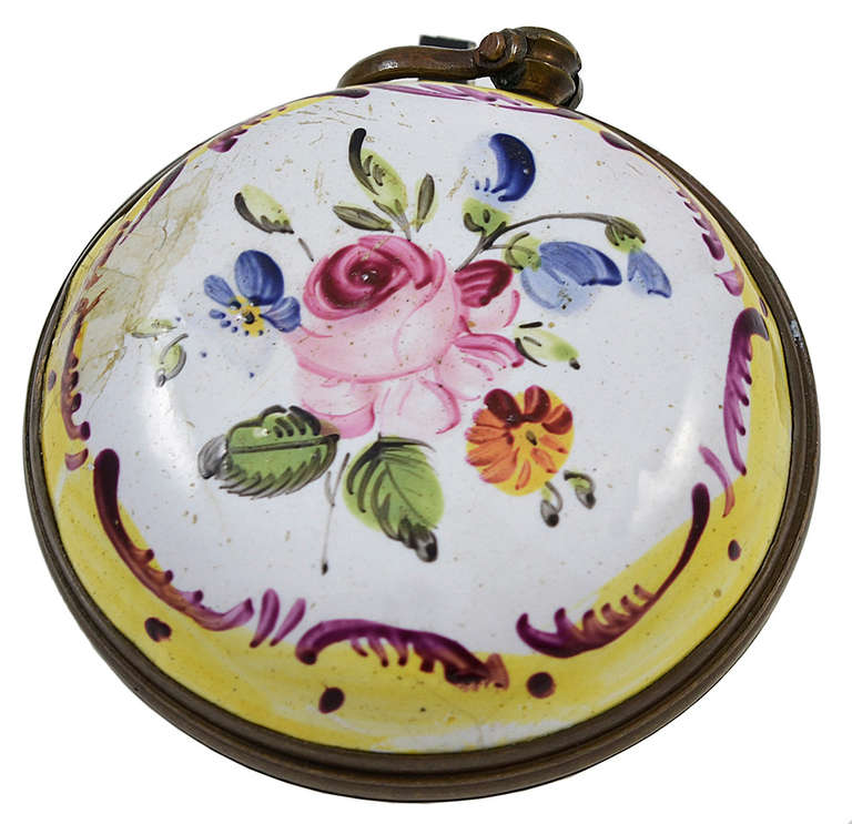 Georgian enamel watch pendant, with floral decoration on the reverse, was made in Bilston, England c.1770-80.  The pendant is made of enamel painted copper and measures 1 1/2