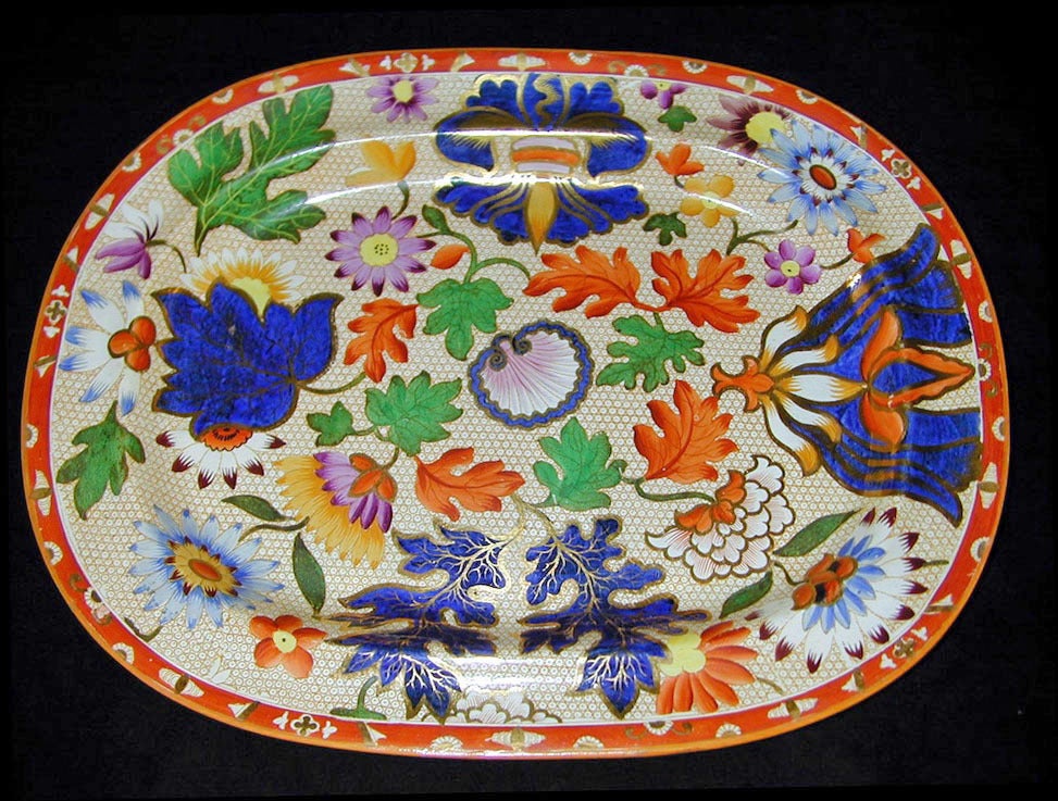 This magnificent Chrysanthemum pattern platter would beautify any sideboard. Spode was influenced by a similar pattern designed by Wedgwood. He greatly enhanced the original by adding more colors and forms such as the fleur de lis at the top and the