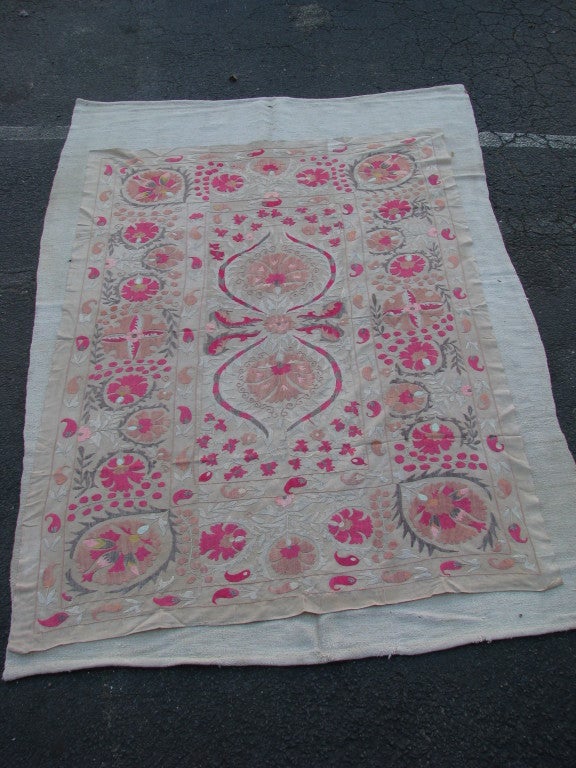 Beautiful, silk hand-embroidery that creates this vintage suzani. Hand-drawn pattern then silk embroidered. Lushious and wonderful Carnation pattern with pastel palette with fusha accents.