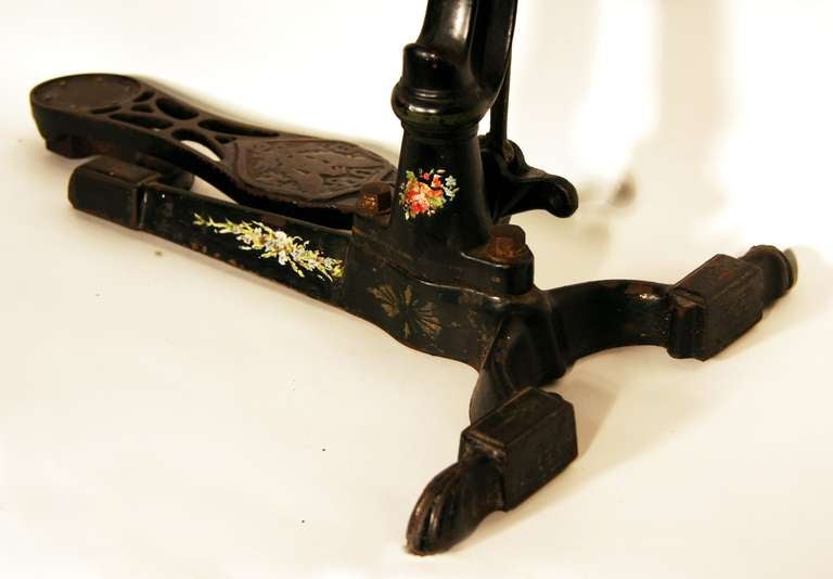 Cast Iron foot powered dental drill. Highly decorative with flower and pinstripe embellishments. large wheel and hand held stainless apparatus comes with unit.