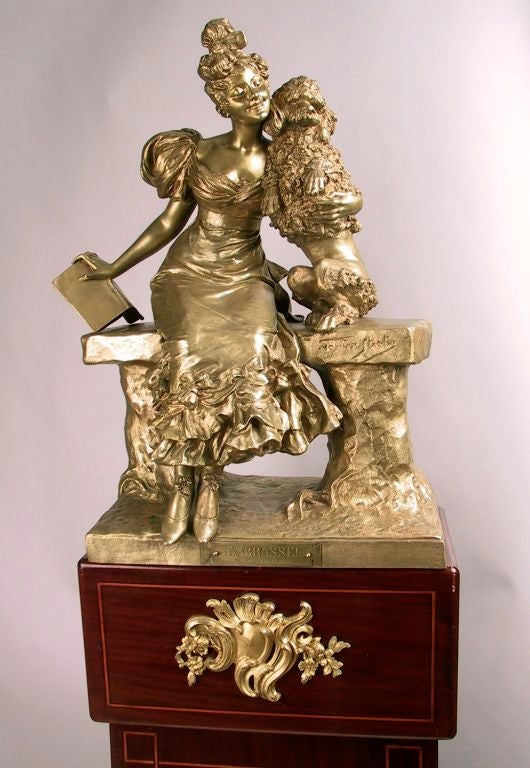 French A Fine Patinated Bronze Of A Young Dancer With Her Pet Dog. For Sale