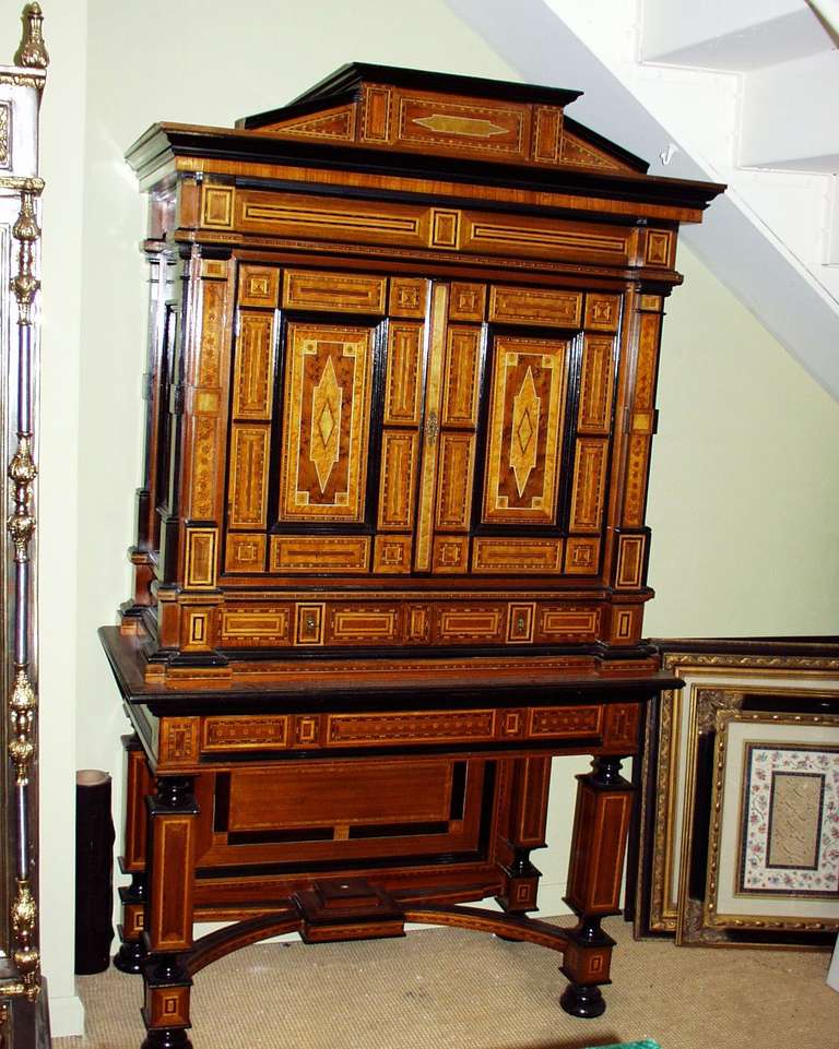 A Highly Impressive Multi- 
Wooded Inlaid Chest on Stand. 
  
  
This impressive and rare inlaid Chest on Stand is constructed to the highest standards. The many different woods used for the inlay have been chosen for their color and grain. The