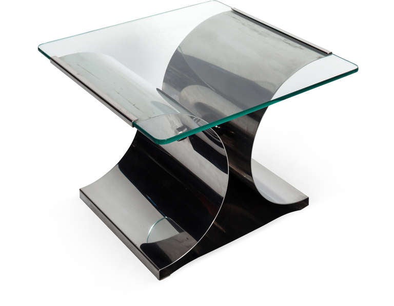 An X-base bent stainless steel side table by François Monnet, France, 1970s. This sculptural side table was crafted from solid stainless steel and features a square polished edge glass top. Connecting ball in blackened steel.