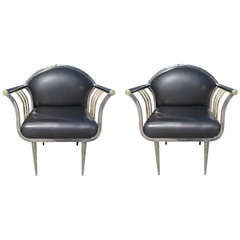 A Pair of Low Club Chairs in Chrome and Brass