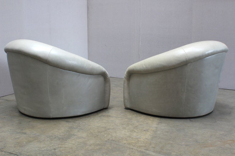 A Pair of 1970s Barrel Back Swivel Club Chairs In Fair Condition In West Hollywood, CA