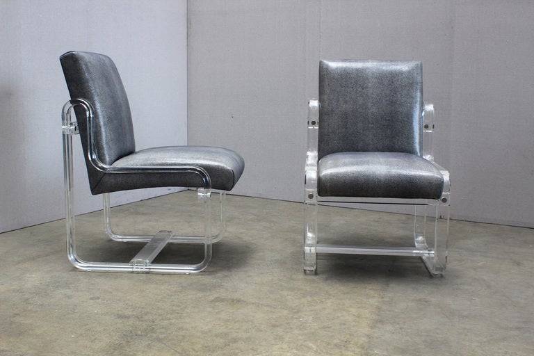 A Great Pair of Lucite Chairs. USA, c.1980s.  These sidechairs are in bent acrylic and are covered in shagreen embossed patent leather.
Great original condition.