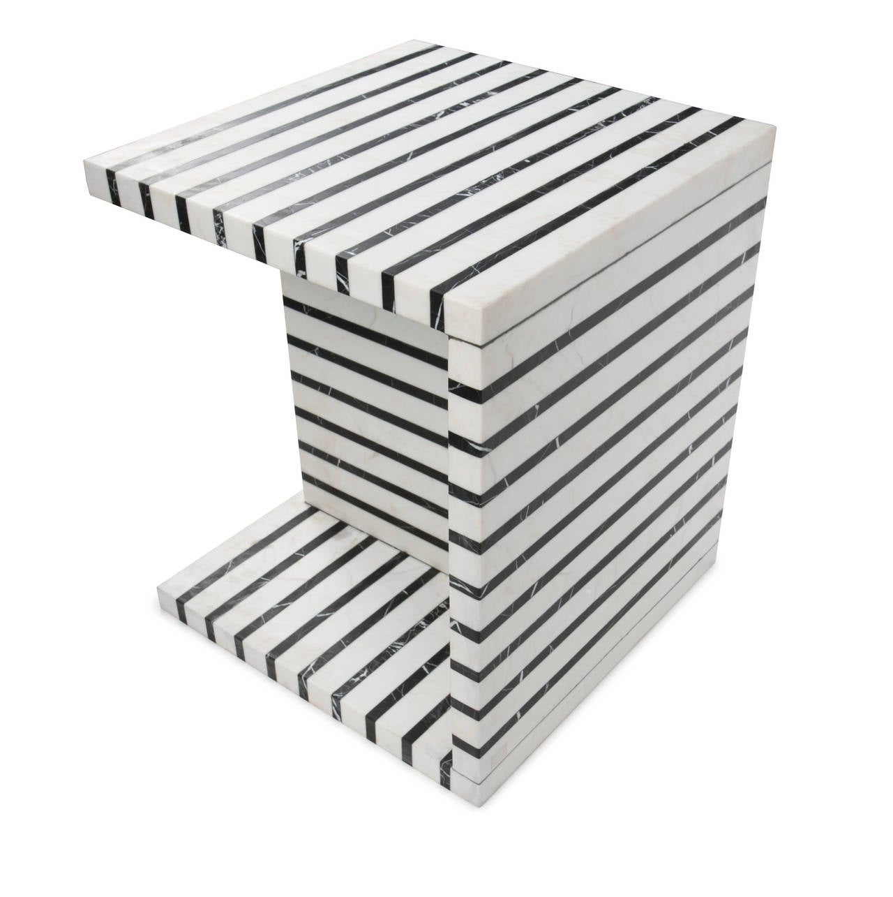 Exemplifying Kelly’s love of mixed marbles, this black and white striped occasional or side table is perfectly proportioned for use in a living room or lounge arrangement. Each of the slabs that form the table are executed in alternating layers of