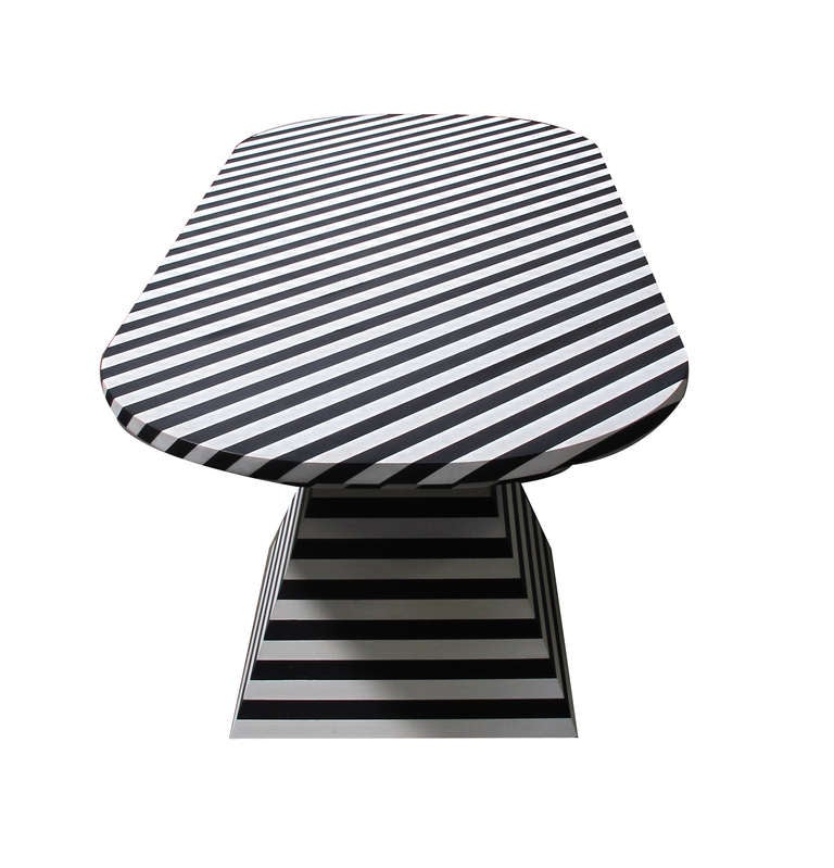Black and white striped dining table by Kelly Wearstler, USA, 2012. This substantial and graphic table was designed by Kelly for use in her Bergdorf Goodman boutique. The handmade base forms and table top are constructed from solid oak. Perfect for