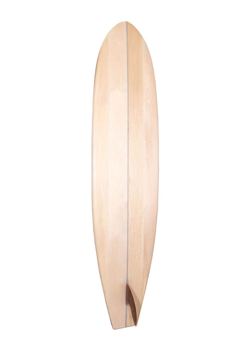 Inspired by Kelly’s love of Malibu Surf Culture, this unique decorative surfboard bears the name of the famously winding California road, Mulholland Drive. The handcrafted puzzle design features a spectrum of rich woods in walnut, cherry, koa, ash,