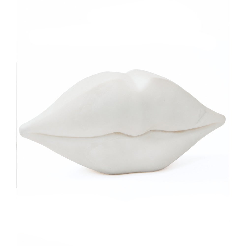 The Little Kiss, available in classic marble, and a variety of semi precious stones, is inspired by Kelly’s love of classic sculpture and figural form, this sexy and iconic home accessory is a sultry accent for your vanity or dining table.