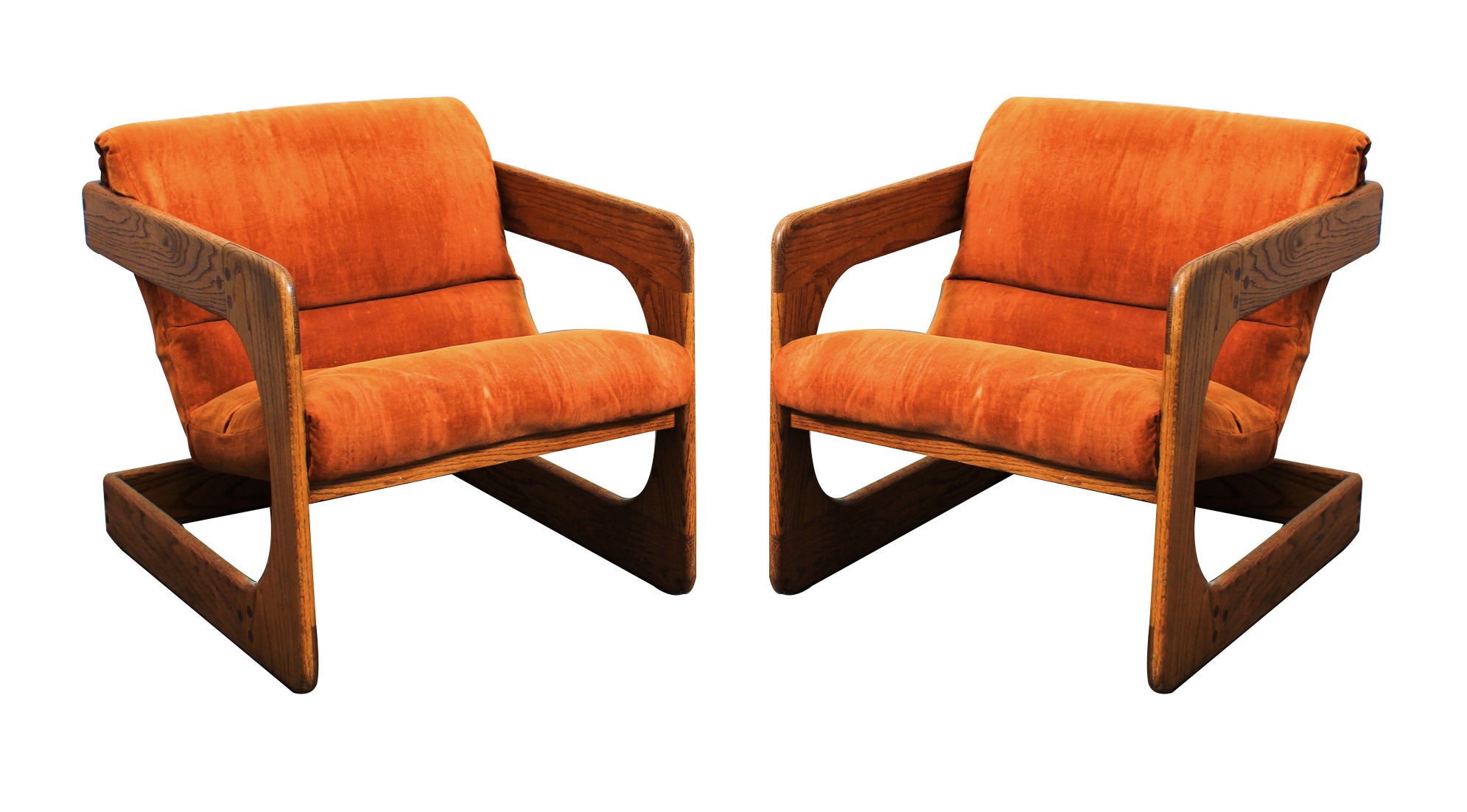 A Pair of Walnut Lounge Chairs by Lou Hodges