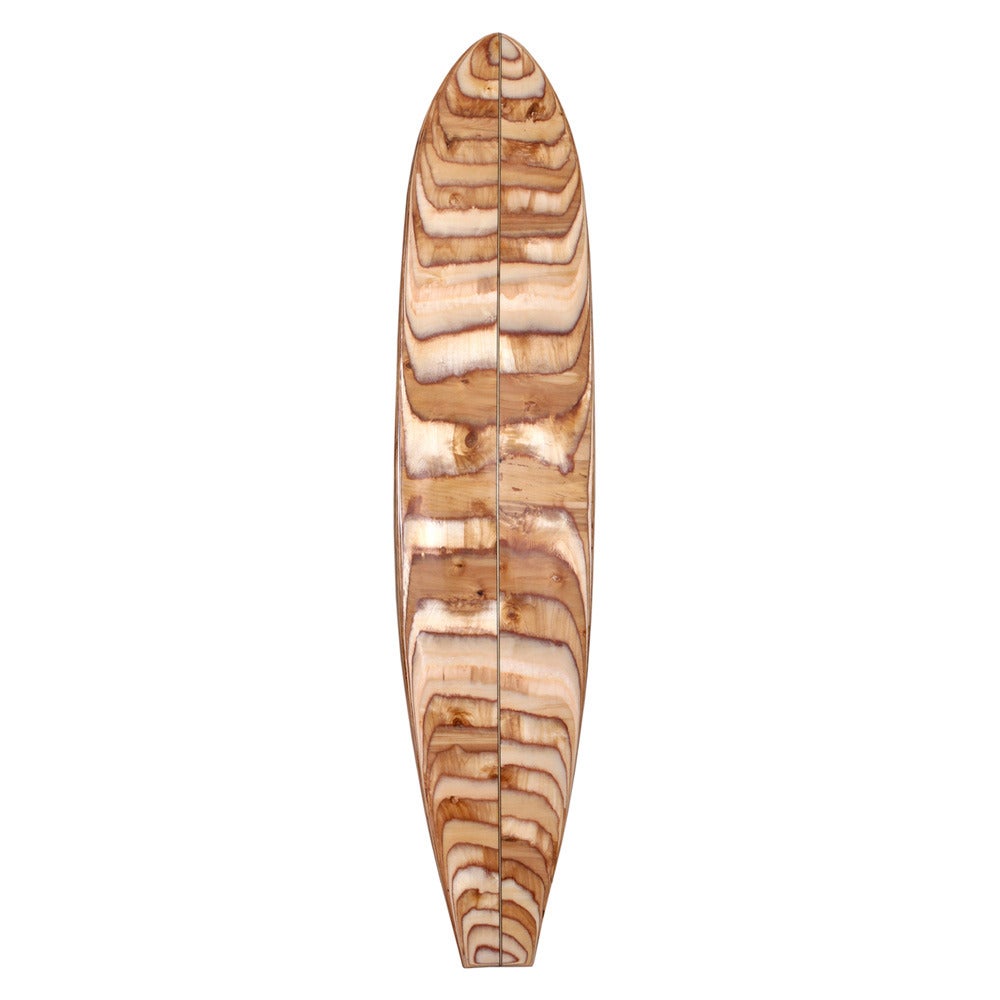 Handcrafted from shaved Russian Birch plywood and finished with genuine surf resin, this unique decorative surfboard is inspired by Kelly’s love of Malibu beach culture. With a timeless allure and palpable cool, this art piece captures the spirit of