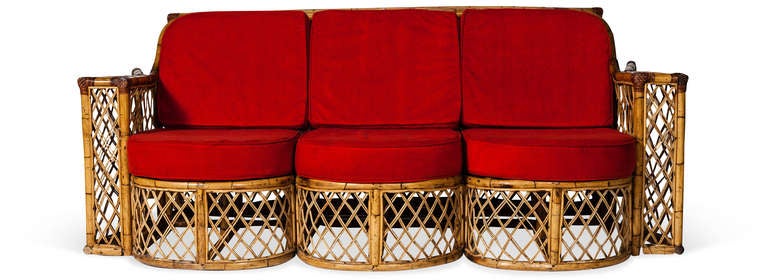 Lattice Rattan 3-Seat Scallop Front Sofa. 1970s. An unusual sofa with Rattan frame with woven cane lattice. loose cushions upholstered in original corduroy. Originally purchased in Paris.