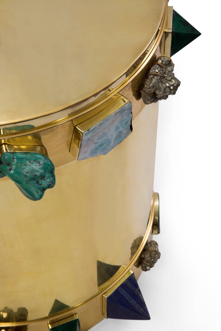 Crafted by artisans in Los Angeles, our Bejeweled banded stool features a variety of hand-selected, bezel set semi-precious stones on a bronze body. Stones include a mixture of lapis, pyrite, druzy, turquoise, malachite and labradorite. This impact