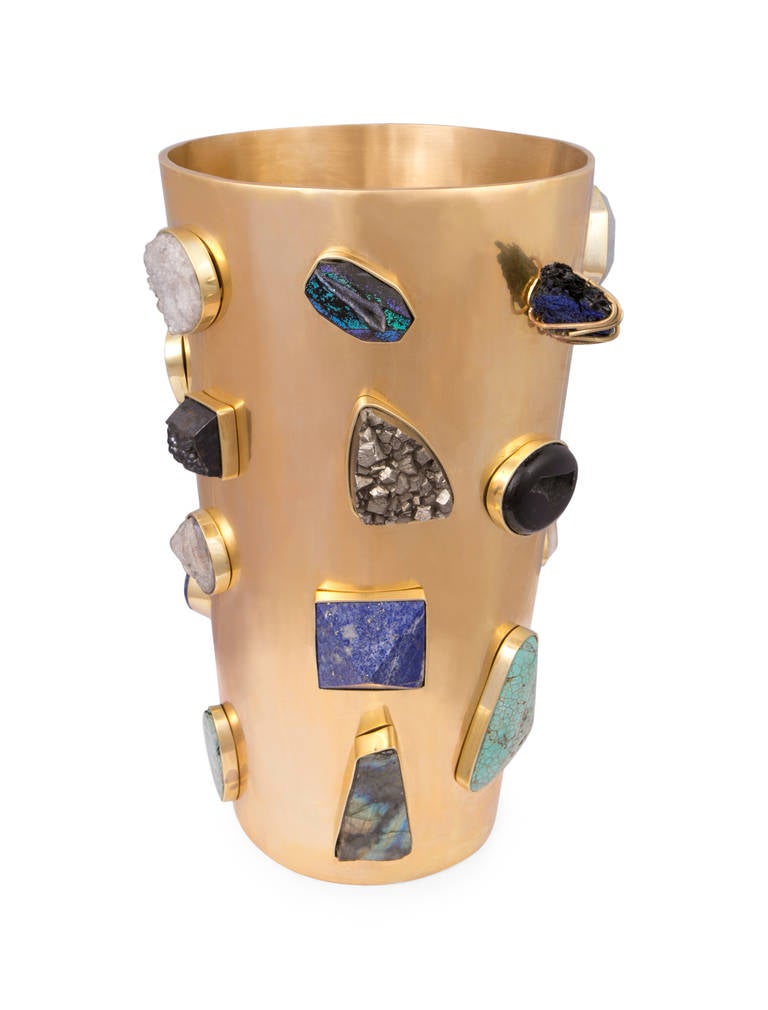 This superluxe bejeweled natural bronze frame is adorned with hand–set semi-precious stones, including Turquoise, Pyrite, Kyanite, Aquamarine, Lapis lazuli, and Labradorite. Each piece is entirely unique, created by Kelly to create a timeless design