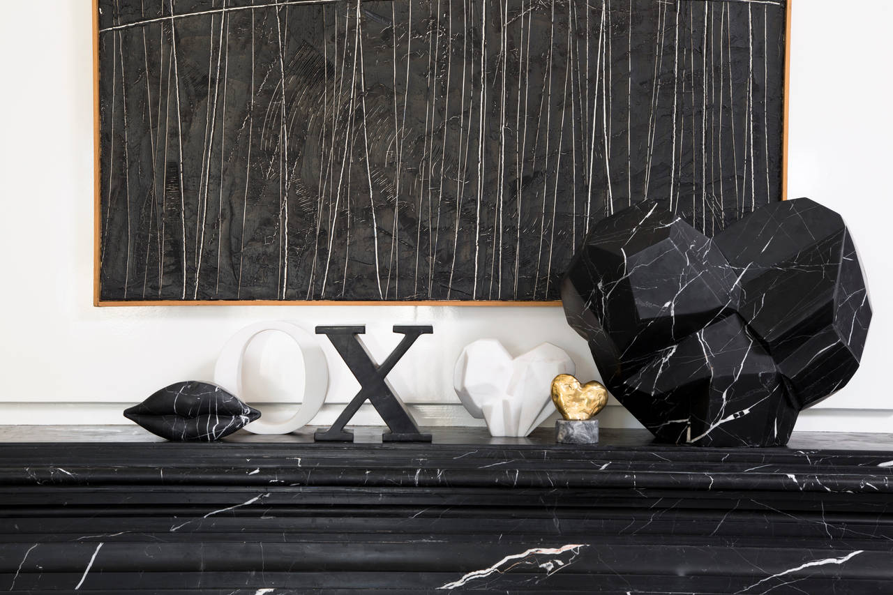 This stately artisanal sculpture is an exotic piece of modern art and vibrant home accessory. Handcarved from honed negro marquina marble it adds an elevated flourish to the mantle, vanity, or console.
Available in Negro Marquina or White Calcutta