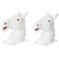 A Pair of White Ceramic Horseheads