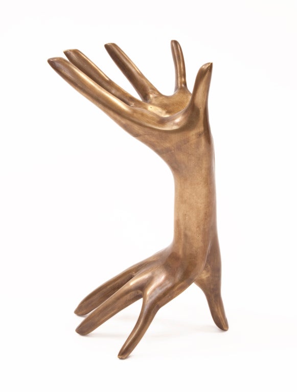 Brass Hands Sculpture by Kelly Wearstler. Our vintage–inspired Brass Hand Sculpture embraces the body in a fantastical way. Made in solid, heavy, signature custom burnished brass that deepens over time, our Brass Hand Sculpture adds richness to both