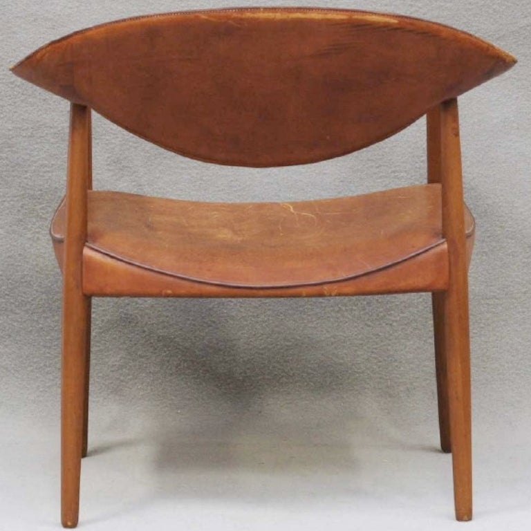 Very Rare EJNER LARSEN and AKSEL BENDER MADSEN 'Metropolitan' armchair, circa 1959 Teak, leather.

Produced by cabinetmaker Willy Beck and leatherwork by Dahlman saddlers, Denmark. Underside with metal label impressed 'PRODUCED