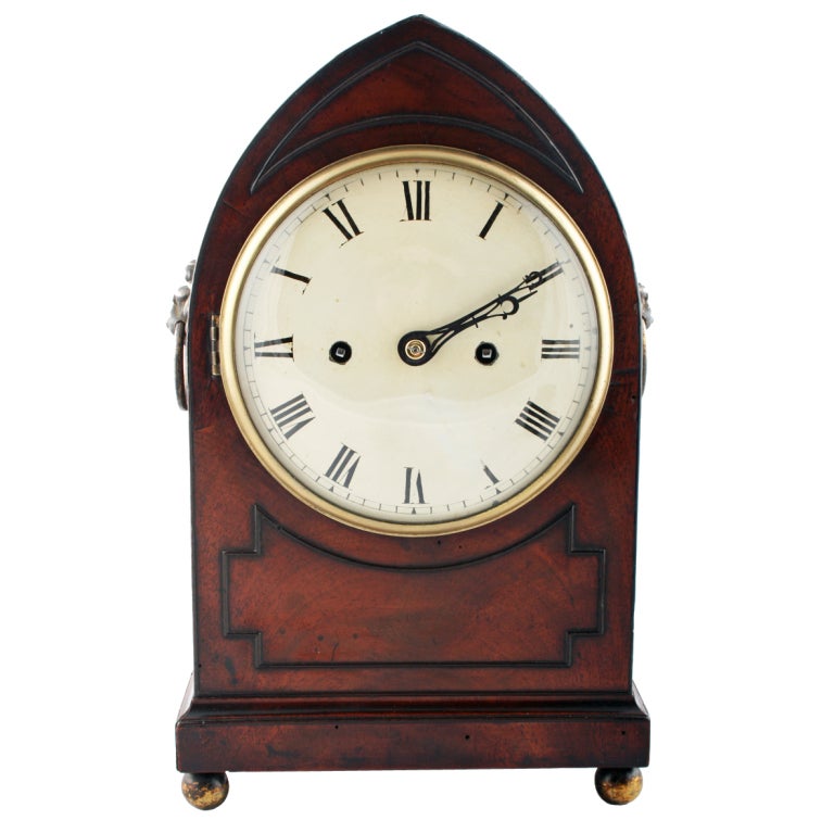 An early 19th century Regency bracket clock with a mahogany lancet shaped case.

The clock has a double fusee movement which strikes the hour on a bell, the back plate is engraved with the maker's name 'Thomas Shepherd Wootton Underedge'.

The