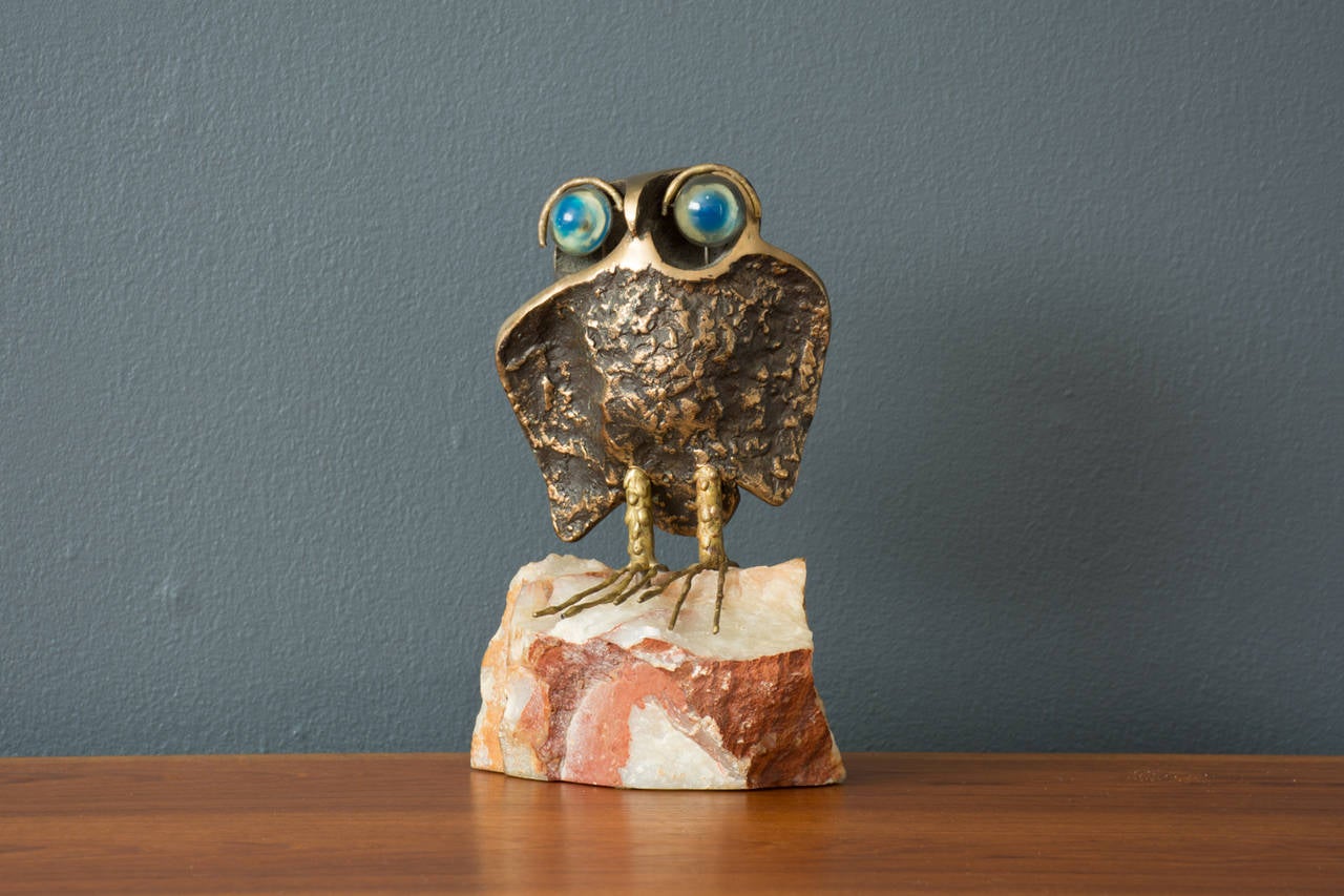 This is a vintage Mid-Century owl sculpture by Curtis Jere, 1969.  It has a heavy stone base, bronze body, and glass beads for eyes.