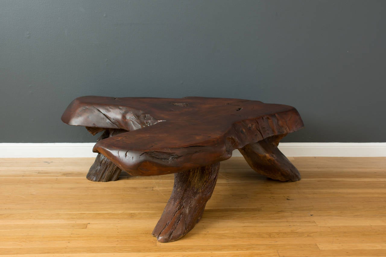 This is a vintage Mid-Century Burl Redwood Slab coffee table.