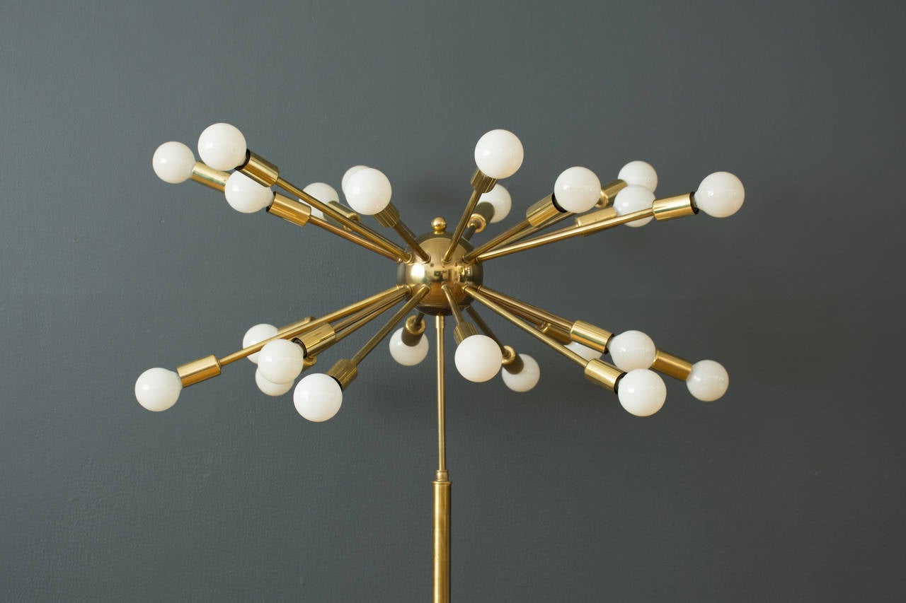 This is a Mid-Century Modern Sputnik floor lamp with 24 bulbs. Metal with a gold finish.

9.25
