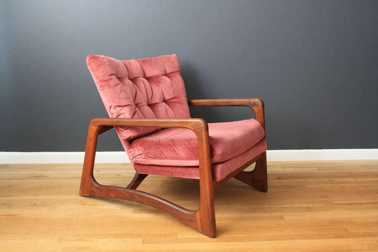 This is a vintage Mid-Century lounge chair by Adrian Pearsall for Craft Associates. It has a walnut frame and the original upholstery.