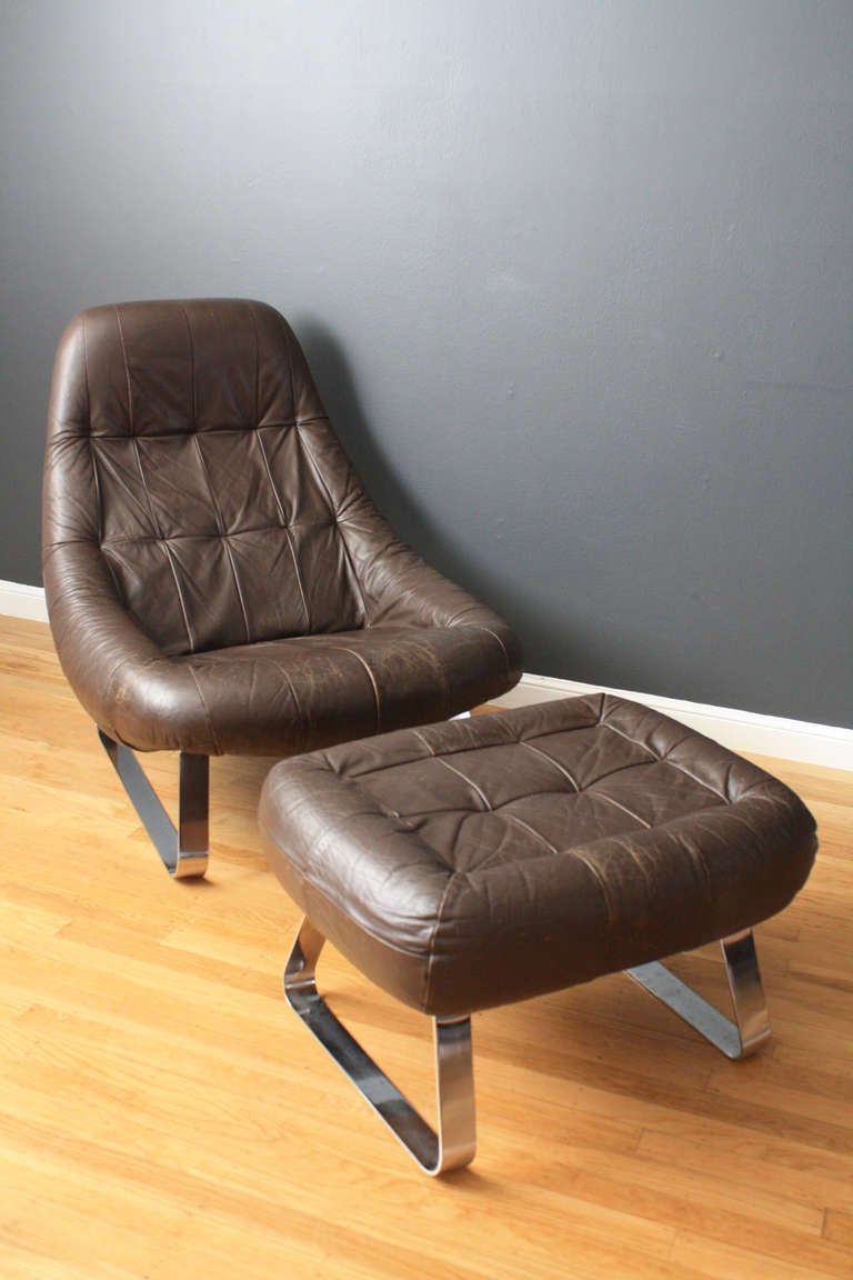 This is a vintage Mid-Century lounge chair and ottoman designed by Percival Lafer for the 