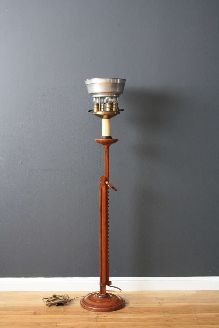 This is a vintage architectural floor lamp that can be raised or lowered (50-66