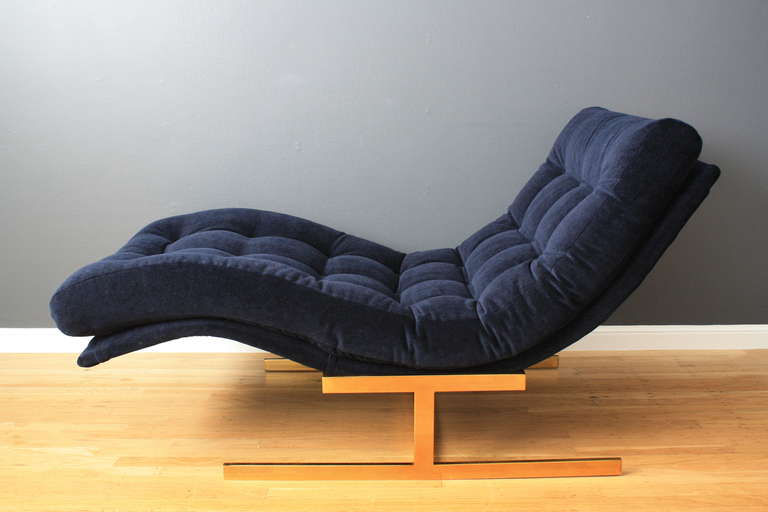 This vintage chaise lounge chair was designed by Milo Baughman. It has been professionally reupholstered in indigo blue mohair. It is 57