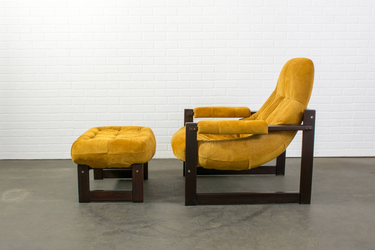 This is a vintage Mid-Century lounge chair and ottoman by Percival Lafer, Brazil, circa 1970s. This chair has a rosewood frame and yellow suede upholstery.