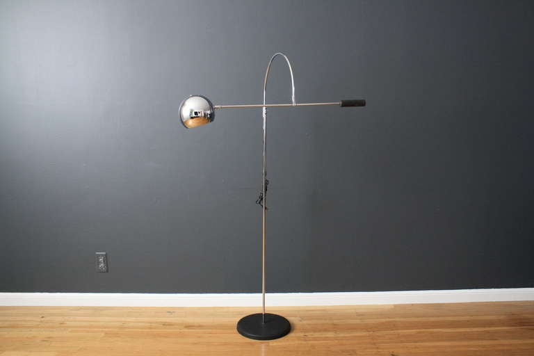 This is a Mid-Century Modern floor lamp by Robert Sonneman.  The arch at the top rotates, and the 27.75