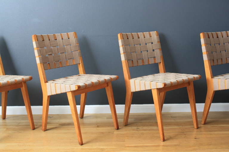 This is a set of four vintage Mid-Century chairs designed by Jens Risom in 1943. They have maple frames and the original webbing. Table sold separately.