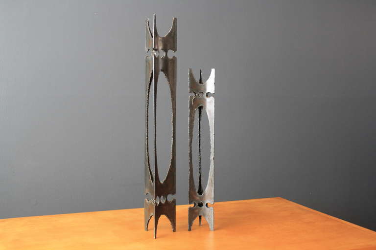This is a pair of vintage Mid-Century brutalist candle holders. They are metal with sculptural details. 
Measurements: approx. 31.25