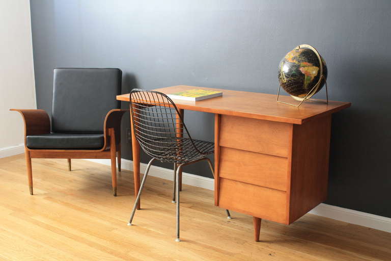 This is a Mid-Century Modern Model 17 maple desk designed by Florence Knoll in 1952.