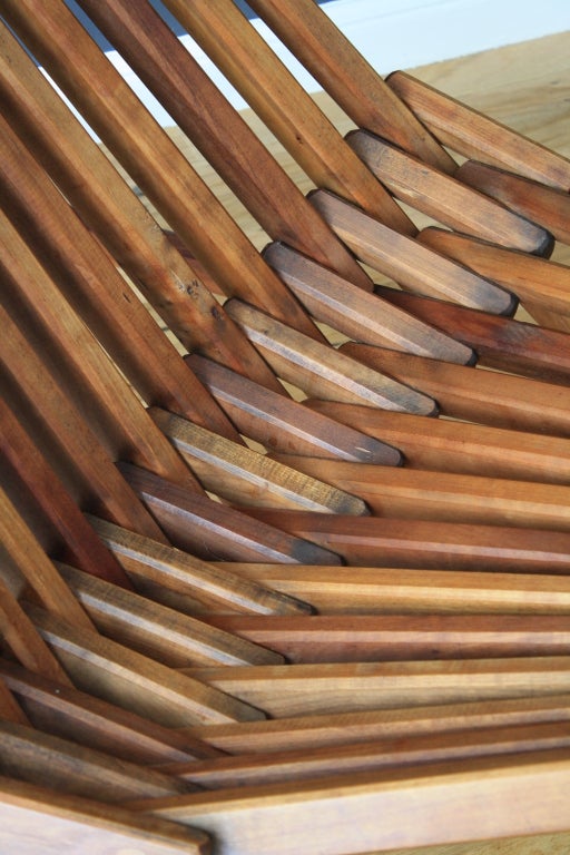 This is a vintage Mid-Century teak Panamericana folding chair that can be used inside or out.
