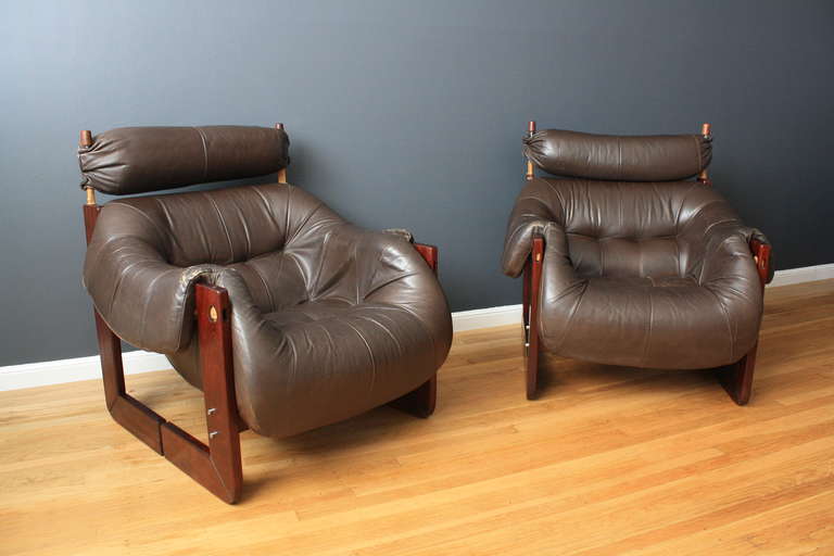 This is a pair of rosewood and leather lounge chairs designed by Percival Lafer. They are well made and very comfortable.